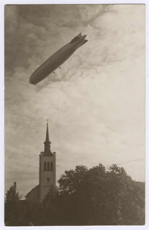 Airship "Graf Zeppelin" above the city, under the tower of the Yann Church.