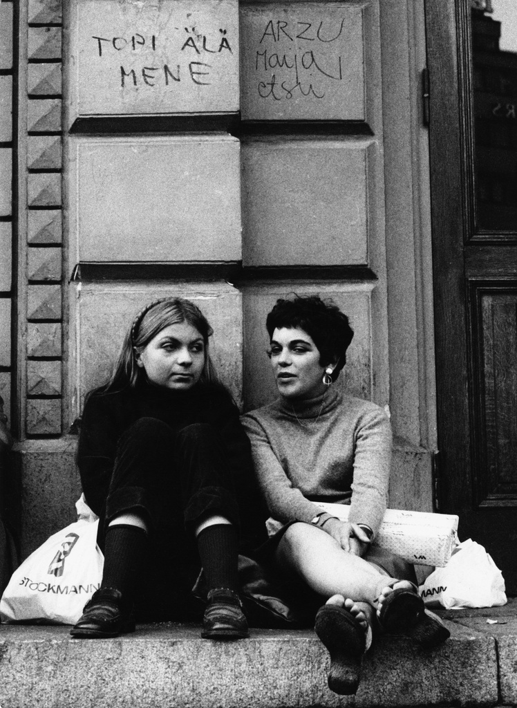 Youth sitting on the stairs of the Old High School House.