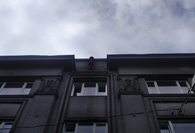 Apartment building with shops in Tallinn, Tatari 6, on the facade floor - the top side of the house with flag belts and captains; pictured from the lift. Architect Eugen Sacharias rephoto
