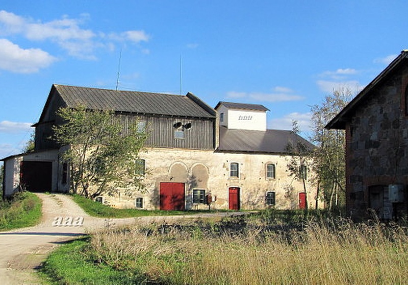 The former water spring of Vohnja Manor. (now grain dryer). rephoto