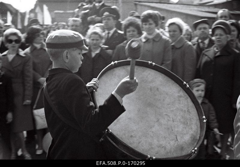 A small drummer on a male parade.