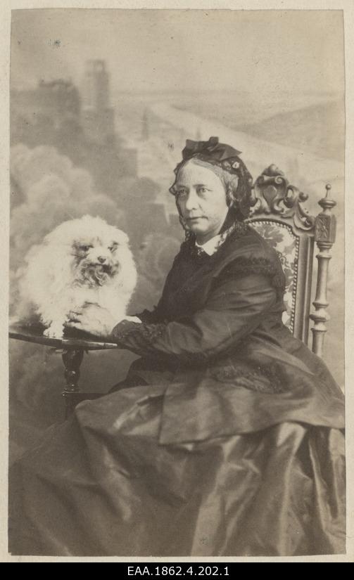 A portrait of older lady with a dog
