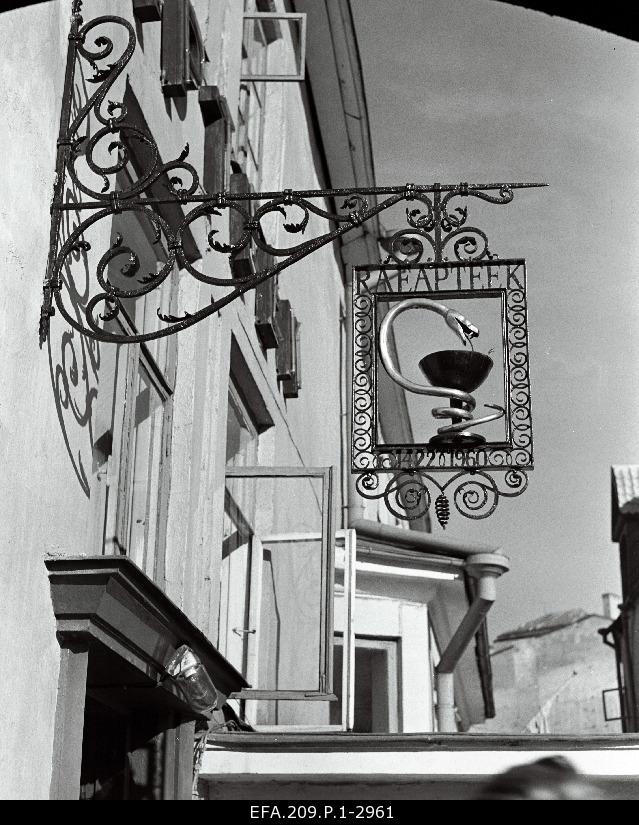 The pharmacy emblem on the main pharmacy façade.