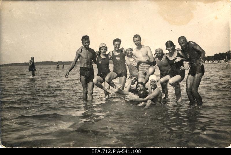 A group of young on the sea beach.