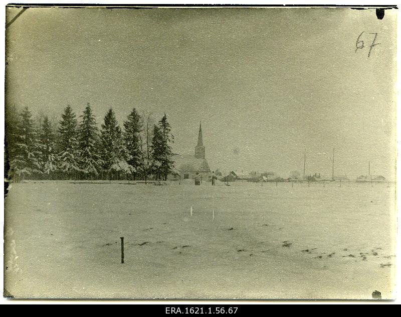 View of the church and village in the background of snow landscape