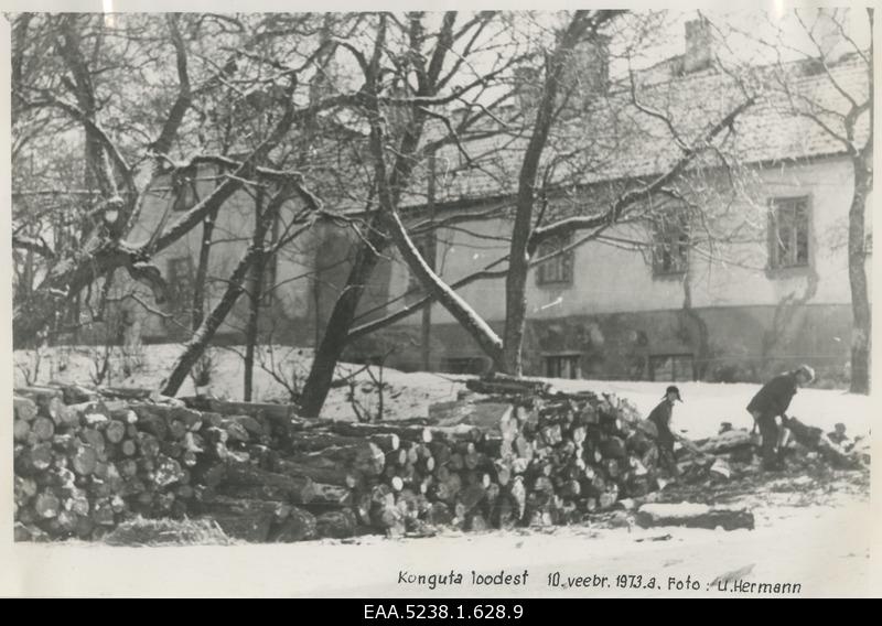 Main building of the Great-Konguta Manor, an unknown man and boy on the right