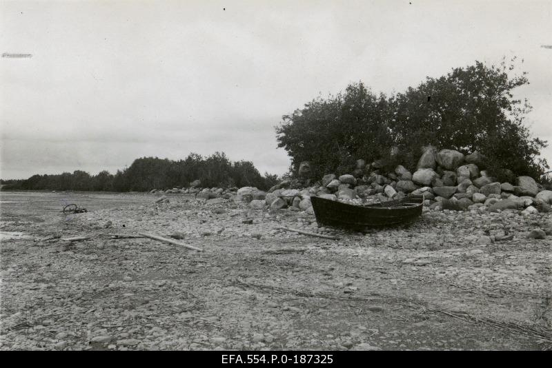 Boat on the rocky beach.