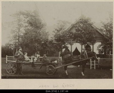 Prof. Raehlmann stood in the yacht equipment and Walter Raehlmann and the boy sat in the plan car in front of the summer house  similar photo