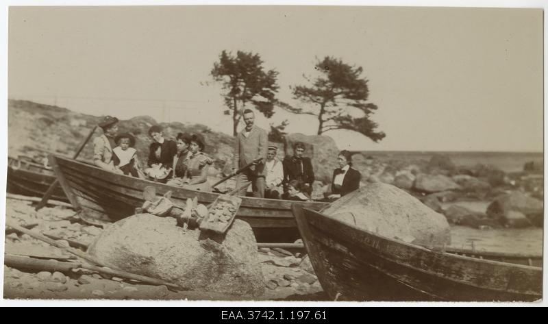 Family members of Raehlmann and Kossmann in a fishing boat near the sea