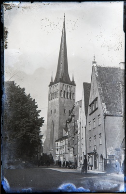 Wide Street - Oleviste church and buildings Lai tn 38 - 48, people on the street with bicycles and cars.  duplicate photo