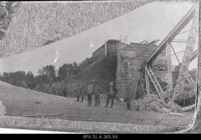 War of Liberty. 6.The 8th Route soldiers reloading the linen from the red war garden at the broken railway bridge of Volmar (Valmiera) to the narrow-minded armour train no.4.  duplicate photo