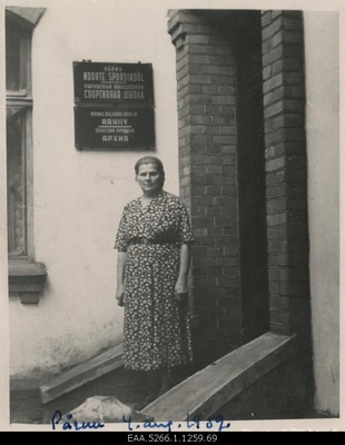 Natalie Valger on the stairs of the archives building in Pärnu city and county  similar photo