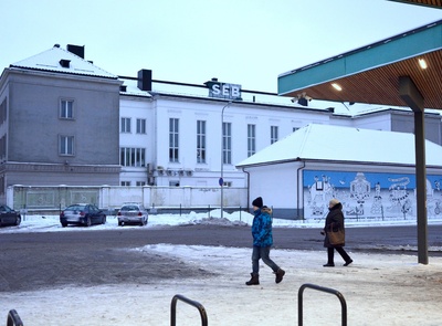 Natalie Valger is sitting on the Pärnu Railway Station Perron Pipe rephoto