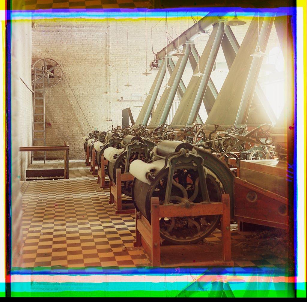 [cotton textile mill interior with machines producing cotton thread, probably in Tashkent] (Loc)