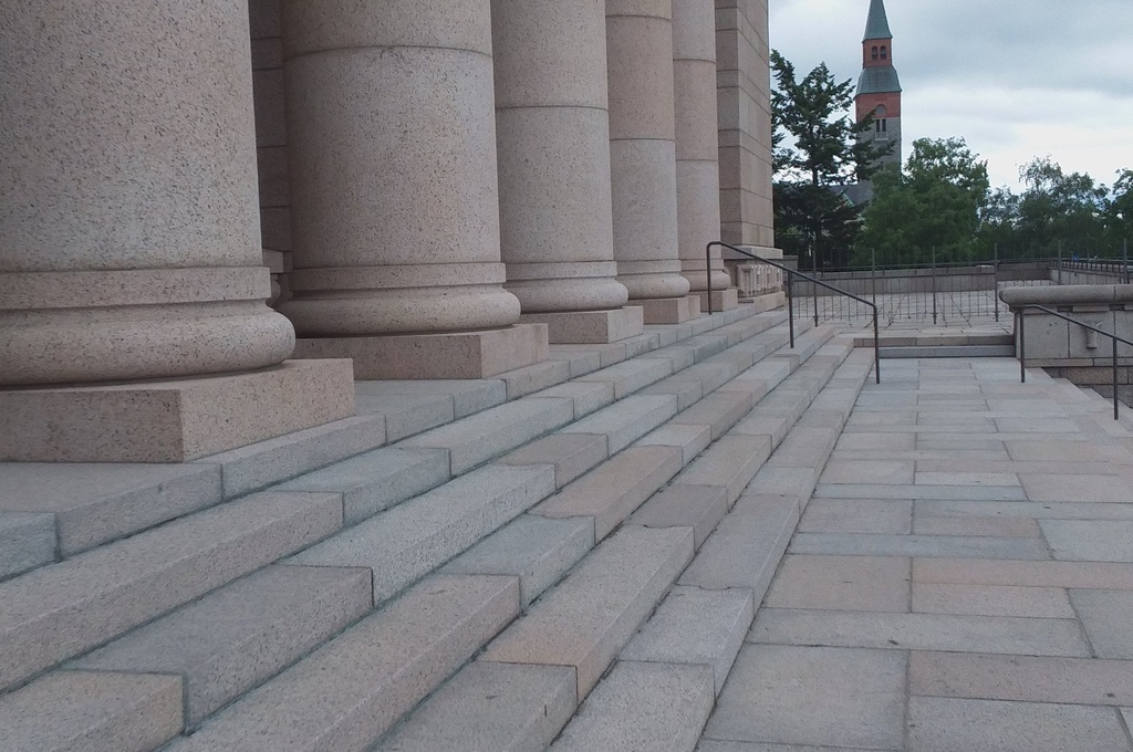 Mannerheimintie 30. Men (People?) On the stairs of the House of Representatives, following a demonstration demanding higher education democracy. rephoto