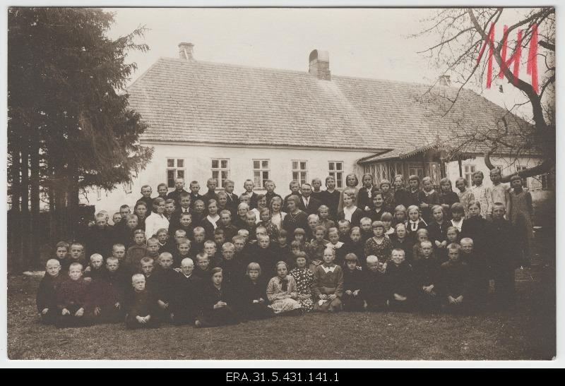 Koonga primary school students in front of the school house