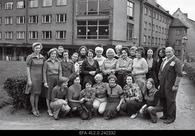 The cafe "Pegasus" personnel in the green area of Harju Street in the background of the cafe.  similar photo