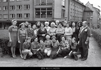 The cafe "Pegasus" personnel in the green area of Harju Street in the background of the cafe.  similar photo