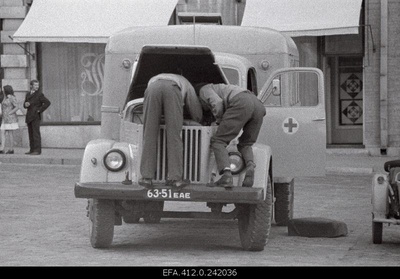 Militias Repair of operation cars on the Raekoja square.  similar photo