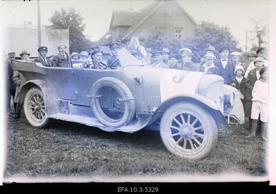 Car racing drivers in their car.  duplicate photo