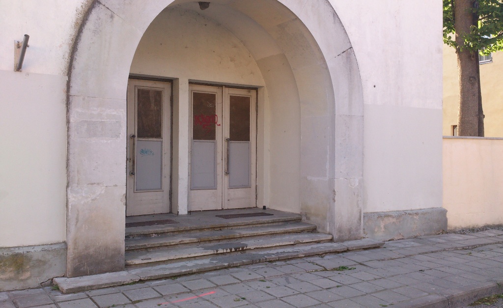 Visitors enter another film show in the cinema in October rephoto