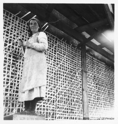 CH-NB - Estonia, Valk-Walk (Valga)- people - Annemarie Schwarzenbach - SLA-Schwarzenbach-A-5-16-134 - Estonia, Valk/Walk (Valga): people; older woman when flying a house  similar photo