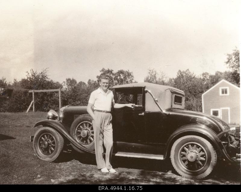 Ernst Jaakson next to his first car.