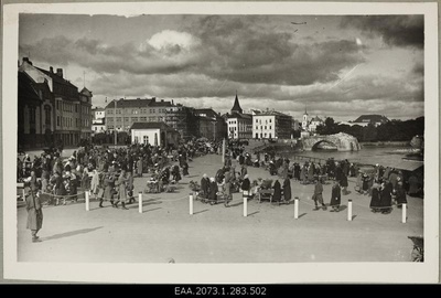 Market and German military personnel in Tartu on the Food Market, on the right broken stone bridge  similar photo