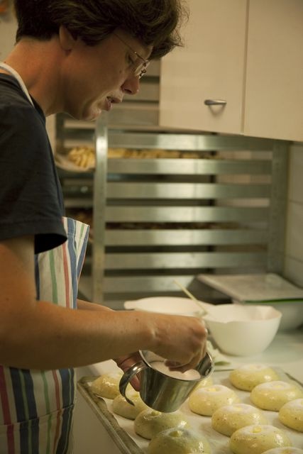 Blue Huvila Café, kitchen; interior picture, employee finishes the bottle