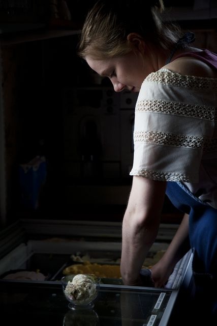 Blue Huvila cafe, employee; closest picture, employee injects ice cream