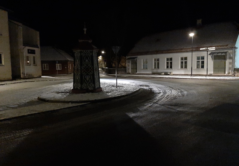 An old town yard with metal coating walls in Kingissepa. rephoto