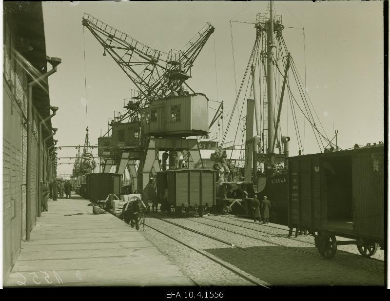 Unloading ships in port.
