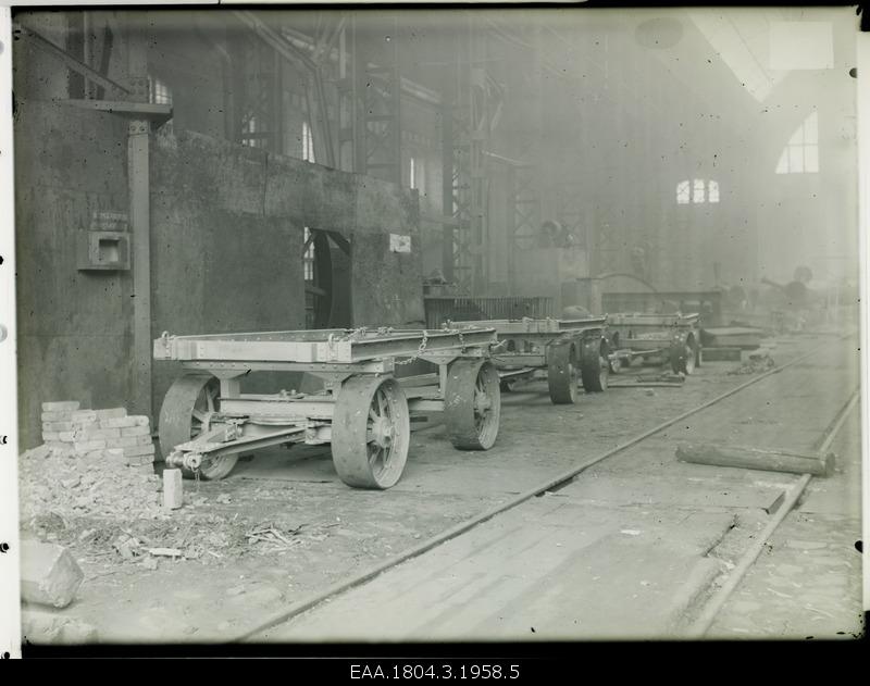 Interior of the factory building, in the front of the trucks