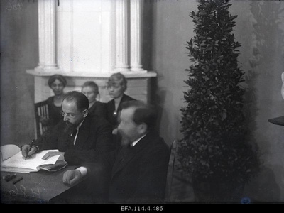 Take peace. President of the Soviet Russian Peace Embassy a. Joffe signing the Soviet Russian Peace Treaty.  duplicate photo