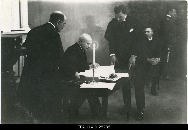 Take peace. Member of the Embassy of the Republic of Estonia Mait Johannes Püümann signing the Estonian-Soviet Russian Peace Treaty.