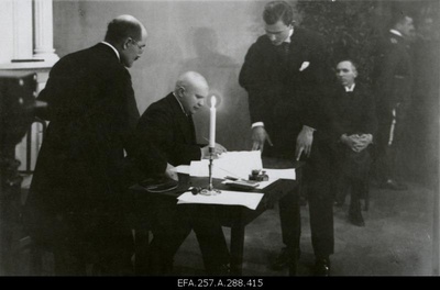 Take peace. Member of the Embassy of the Republic of Estonia Mait Johannes Püümann signing the Estonian-Soviet Russian Peace Treaty.  duplicate photo