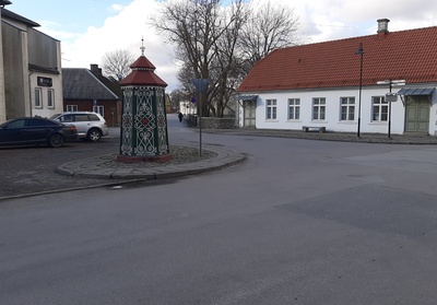 An old town yard with metal coating walls in Kingissepa. rephoto