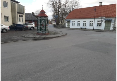 An old town yard with metal coating walls in Kingissepa. rephoto