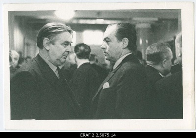 Delegates and guests of the 16th Congress of the ECB in a conversation during the interim sessions of the Congress. From the left cultural figures Kaarel Ird and Georg Ots.  similar photo