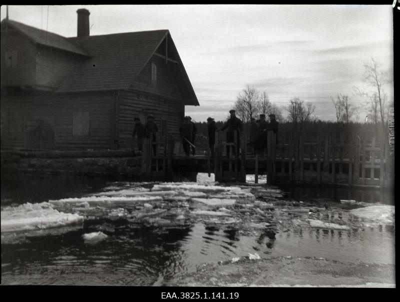 Group of men standing on the waterwater bridge