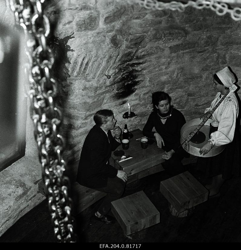 Waiter Aino ice Others serves visitors in the windmill cafe.