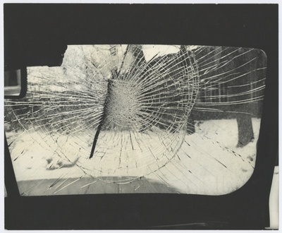 View through the car window: broken front glass.  duplicate photo