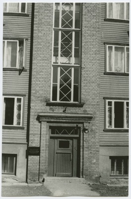 Three-fold wooden house with a stone staircase, Gogol Street 19, the outdoor door of the building and the staircase.  duplicate photo