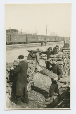 Storage and sale of heating trees at the railway station.  duplicate photo