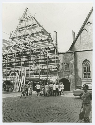 View Pika street, in front of the houses, a group of people.  similar photo