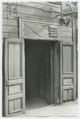 Open-ended wooden door on the 14a house of Paldiski highway.  duplicate photo