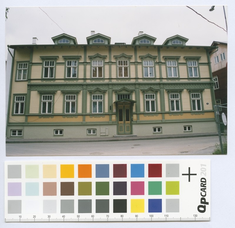 Source Street No. 8. Renovated double wooden house façades.
