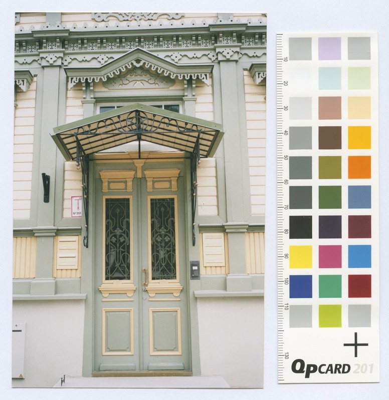 Source Street No. 8. Renovated, wooden beds, apartment door and shadow.