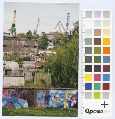 Port of Paljassaare. Port buildings and cranes behind the graphite coated plan.  duplicate photo