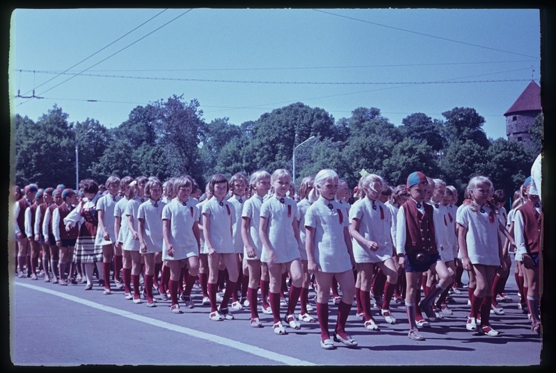 The songs of children's choirs in the train walk.